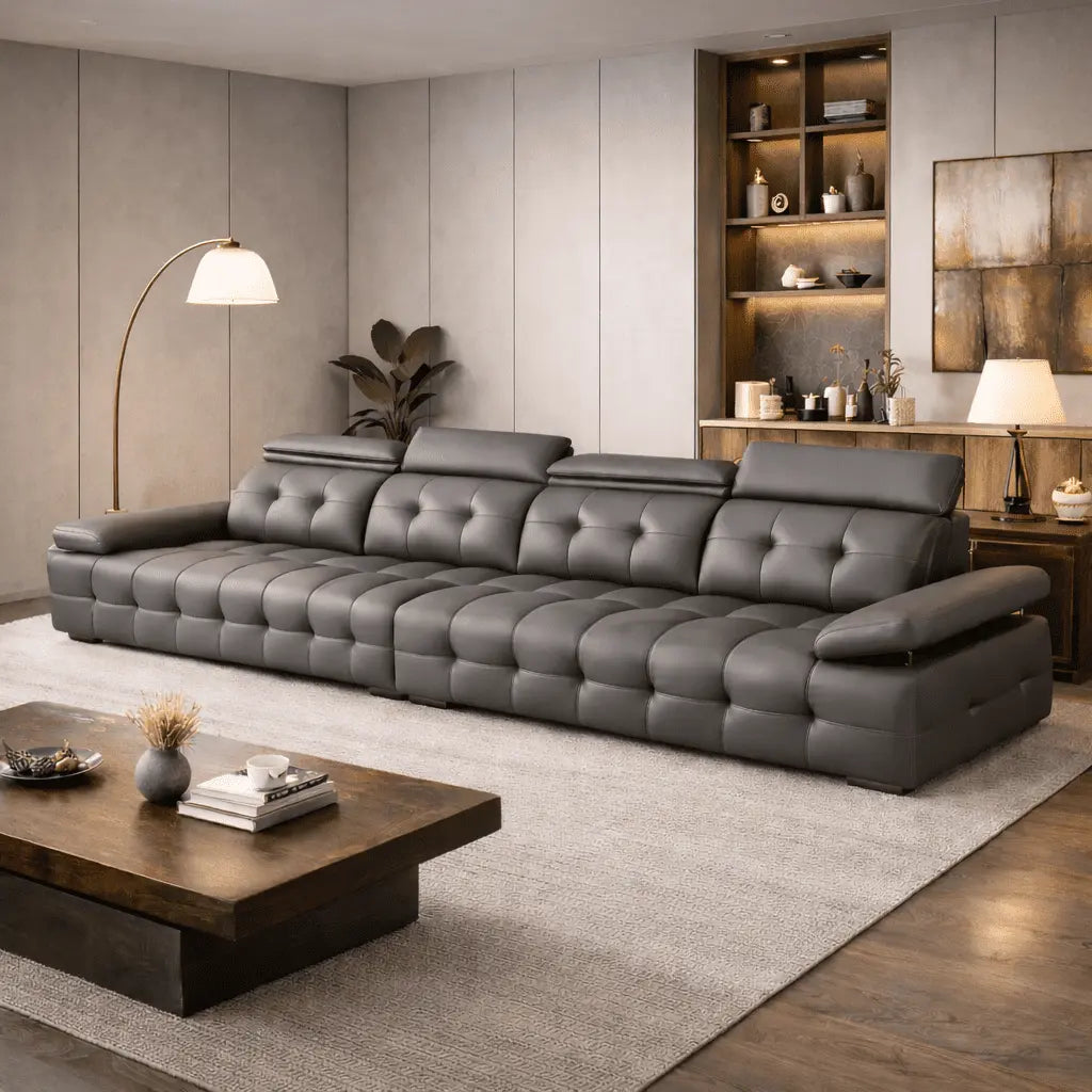 Gray sectional sofa in a modern living room with wooden coffee table and shelves.